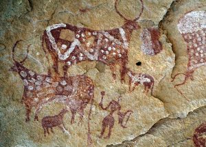 The Ennedi Massif, prehistoric rock art depicting human figures and bovine animals, Explore Chad