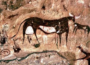 The Ennedi Massif, prehistoric rock art depicting bovine animals and human figures, Explore Chad