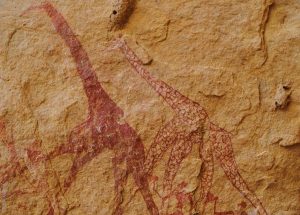 The Ennedi Massif, prehistoric rock art depicting giraffes and human figures, Explore Chad