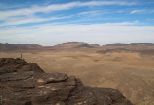 The Tibesti Mountains, Emi Koussi, caldera, Stefan Kröpelin sitting at the rock edge, Explore Chad