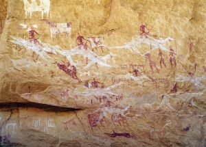 The Ennedi Massif, prehistoric rock art depicting animals and human figures, Explore Chad